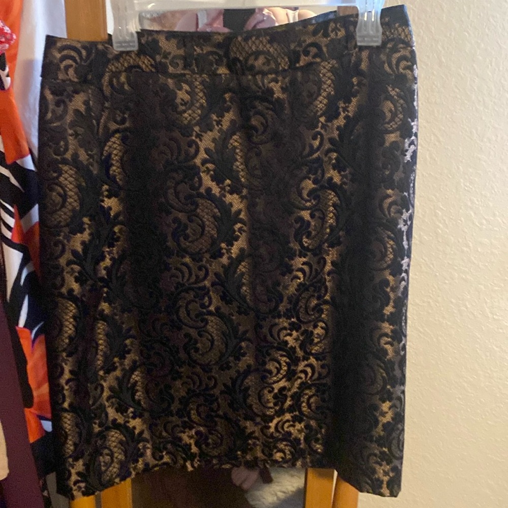 New Worthington black and gold skirt. Never worn. Beautiful skirt.